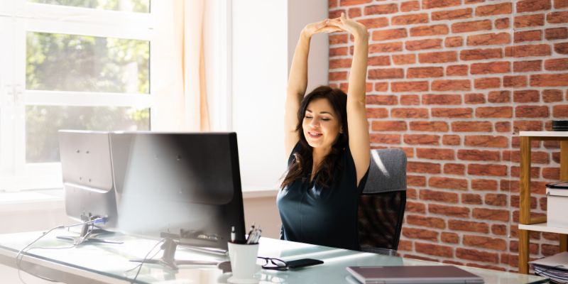 Woman stretching on her workstation