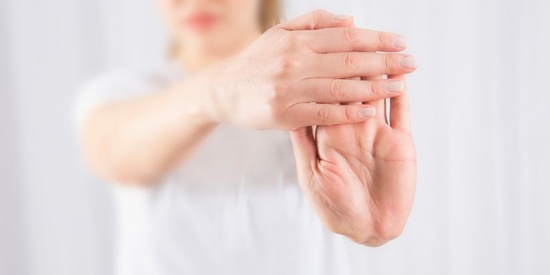 A demonstration of wrist stretching