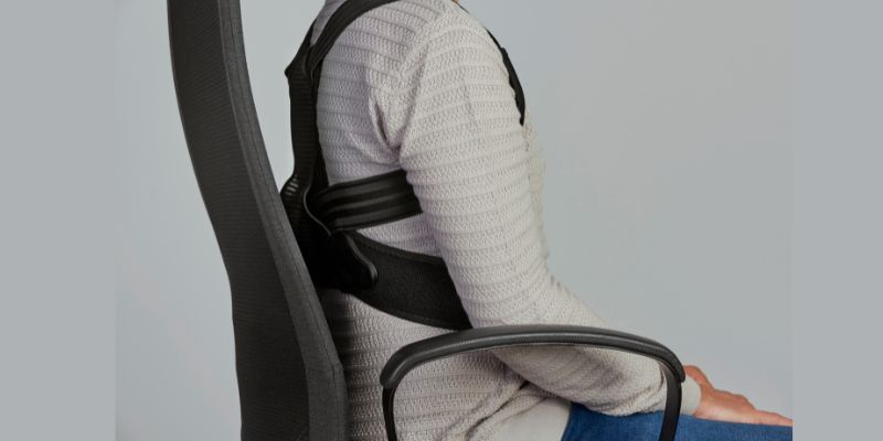 A person wearing a back support vest for posture correction